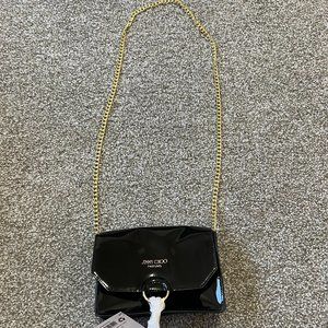 Jimmy Choo Parfums Cross body promo handbag black with golf chain and tassel